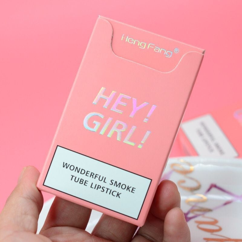 Long-Lasting Moisturizing Lipstick Set 4 Piece in a colorful packaging with text 'HEY! GIRL!'. A trendy cosmetic product.